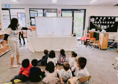 children-watching-chinese-shadow-puppet-performance-at-birth-stree-kindergarden