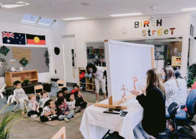 children-watching-chinese-shadow-puppet-performance-at-birth-stree-kindergarden